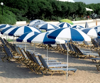 Umbrellas and sun beds on the sea shore