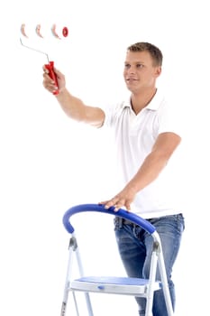 young guy holding painting brush on an isolated white background