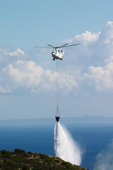 fire fighting helicopter put out forest fire