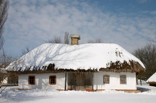 Old peasant's house in the winter scenic