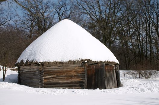 Old wooden peasant's house in the winter scenic
