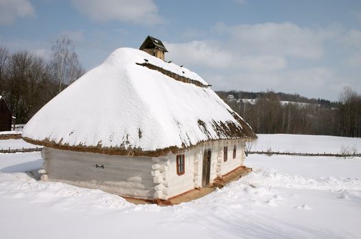 Old rural hut under the snow in winter cuontryside scenic