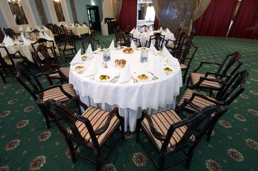 interior of restaurant with layed tables