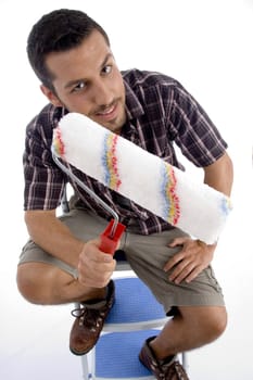 close up view of painting brush and man holding on an isolated white background