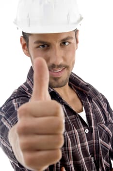 portrait of young guy gesturing thubmbs up with white background