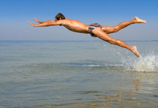 Man fly over sea