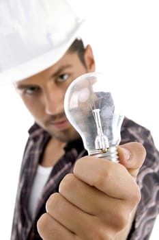 young architect showing electric bulb on an isolated white background