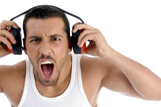 caucasian  guy enjoying rock music with full volume against white background