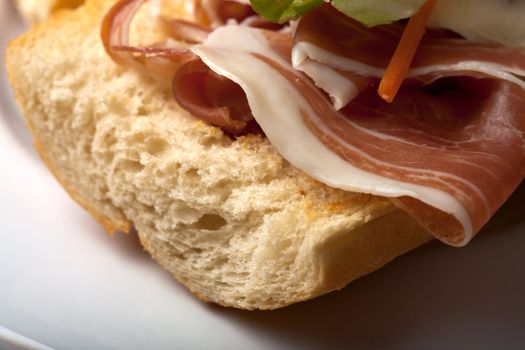 ham sandwich with salad leaves