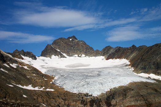 rock and glacier in north norway under blue sky