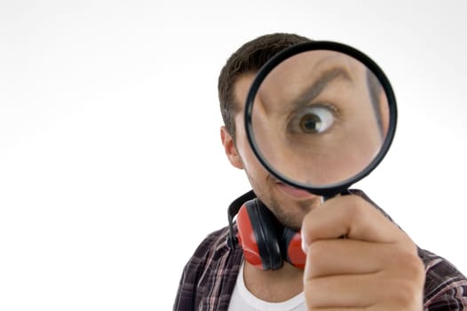 man magnifing his eye on an isolated white background