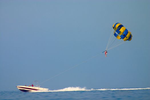 parasailing with boat in sea resert