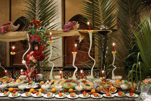 decorated tables with fruit in smorgasbord restaurant in resort