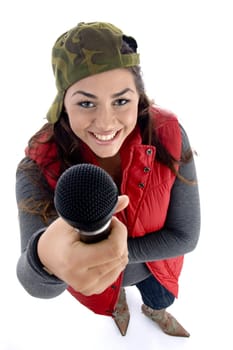 young caucasian offering her microphone with white background