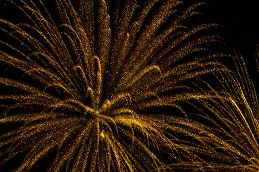 yellow fireworks in black sky