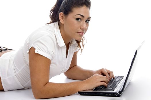 young beautiful female working on laptop on an isolated white background