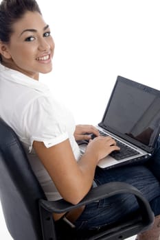 young beautiful female working on laptop on an isolated white background