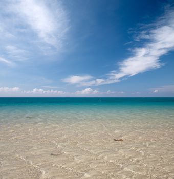 cool blue sea water and sky with clouds