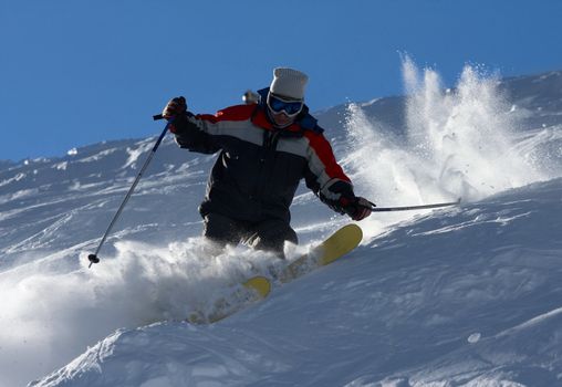 Skier in clouds of snow powder
