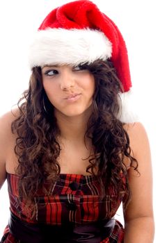 woman with christmas hat making face against white background