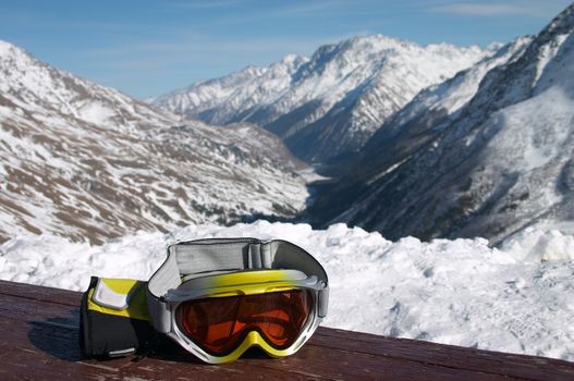 ski goggles on the table in winter mountains