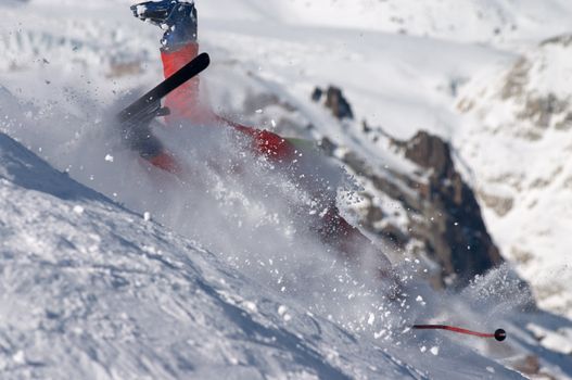 skier falling down the hill on the clouds of snow powder