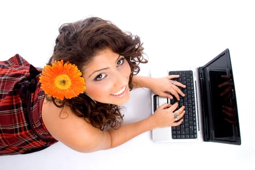 laying woman with laptop on an isolated background
