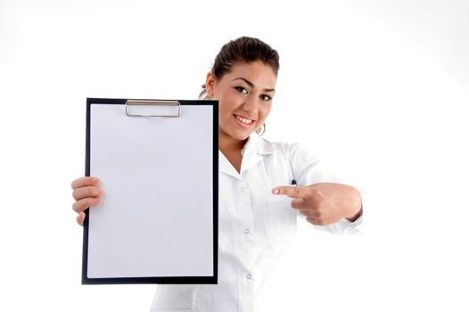 smiling doctor indicating the writing board against white background