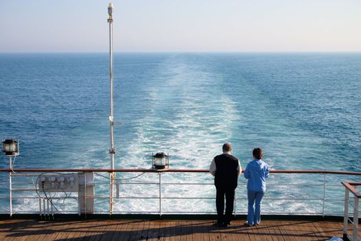 couple of tourist on the cruise liner in open sea