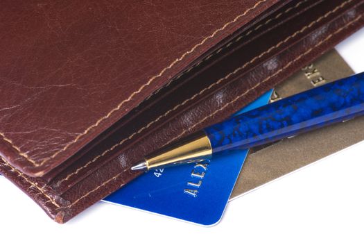 Credit cards, wallet and ball-point pen isolated on white