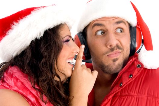 woman asking man to keep silent against white background