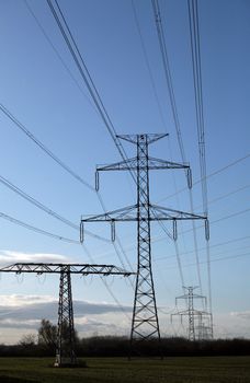 Electric pylons in field