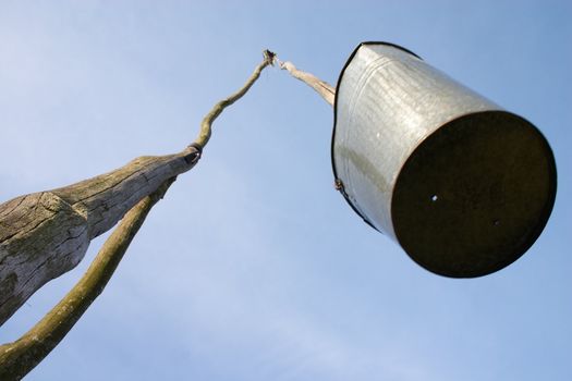 Well sweep with dip-bucket with hole in bottom