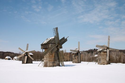 Windmills in the winter countryside scenic under blue sky