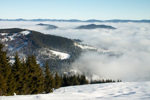 winter landscape with mountains under white clods