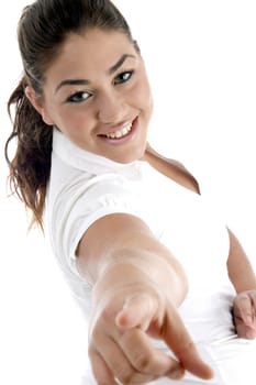 smiling model pointing with white background