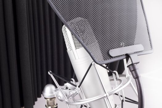 Professional studio microphone on white background