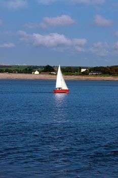 a yacht sailing in youghal bay ireland