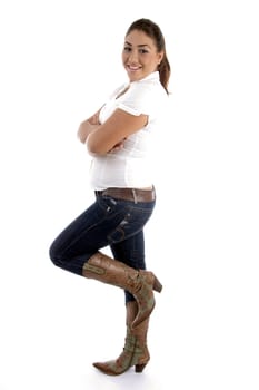 side view of standing woman against white background