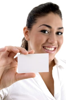 young female showing business card against white background