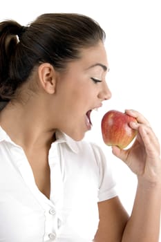 young female going to eat apple on an isolated white background