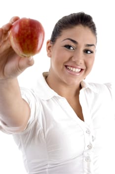 smiling young female showing apple on an isolated background