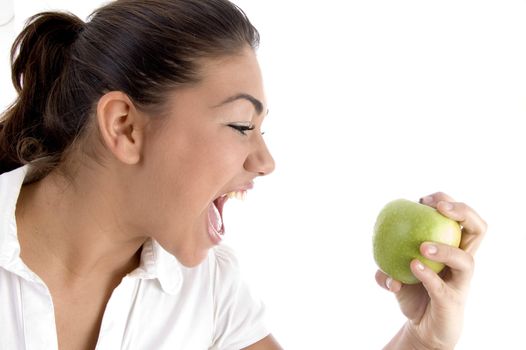 young model going to eat fresh apple on an isolated background