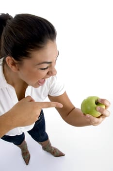 young model indicating the apple on an isolated white background