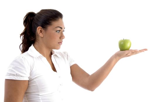 woman looking the apple with white background