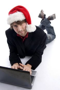 laying man working on laptop on an isolated white background