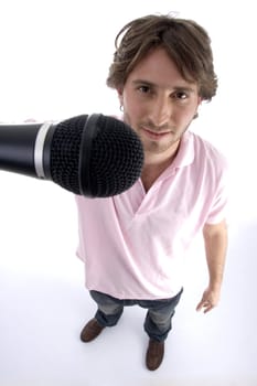 standing man showing microphone on an isolated white background