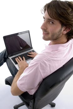 side view of man with laptop on an isolated background