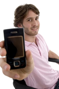 smiling man showing mobile against white background
