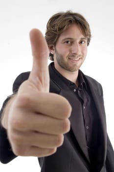 young male wishing goodluck on an isolated white background